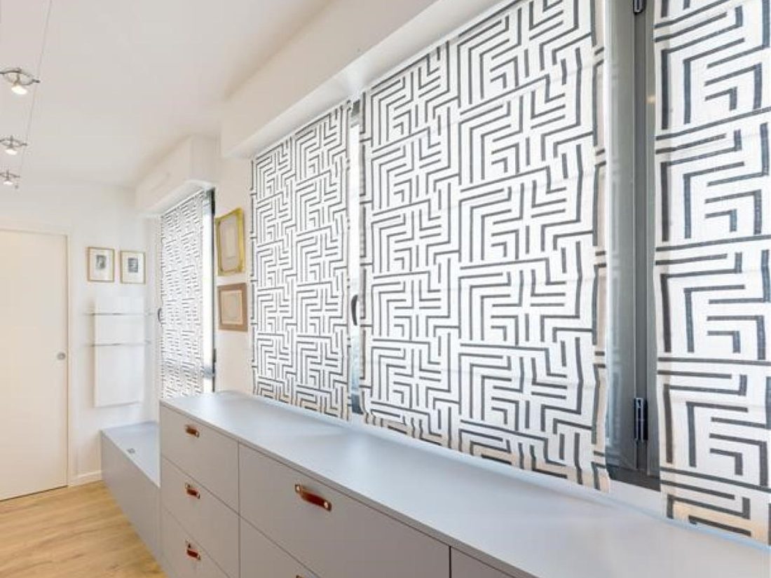 Motorised sun shades on a living room window