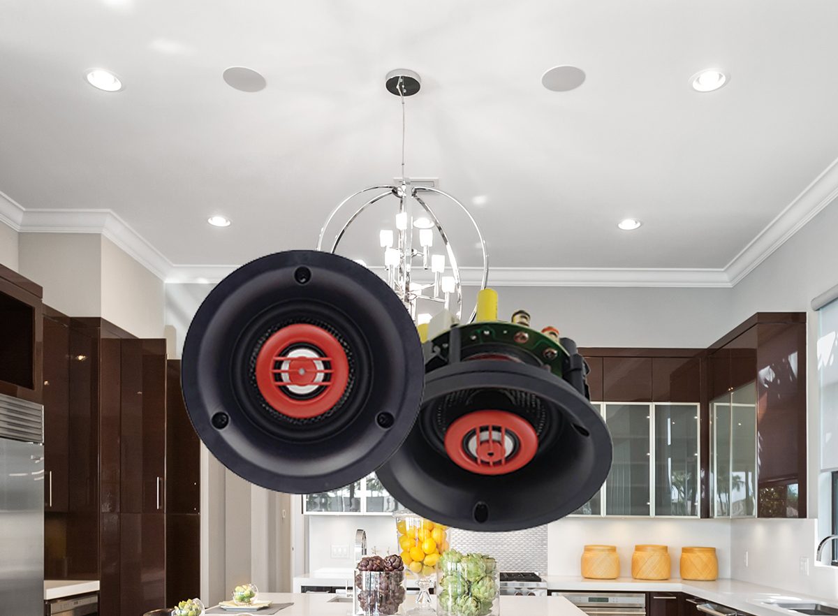 Small round speaker grilles set into a white ceiling