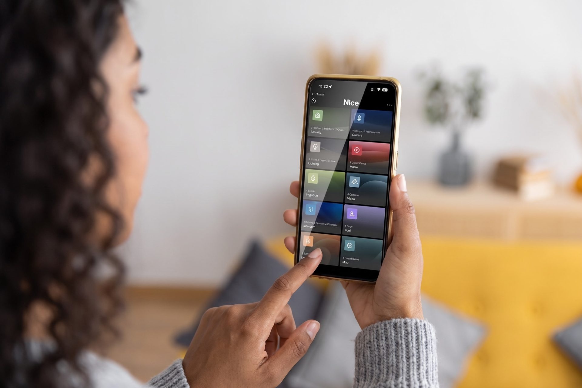 A woman using the home control app on a smartphone