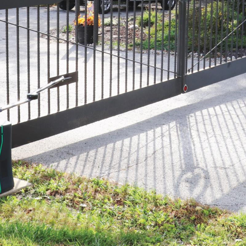 A Smart 535 commercial gate operator installed at a business entrance