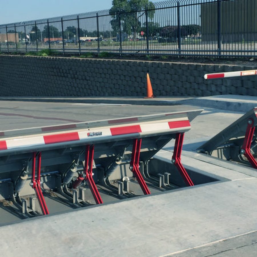 A HydraWedge barrier raised across a roadway