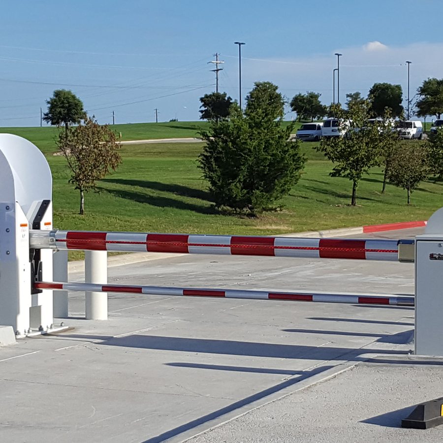 A StrongArm crash-rated barrier arm at a vehicle entrance