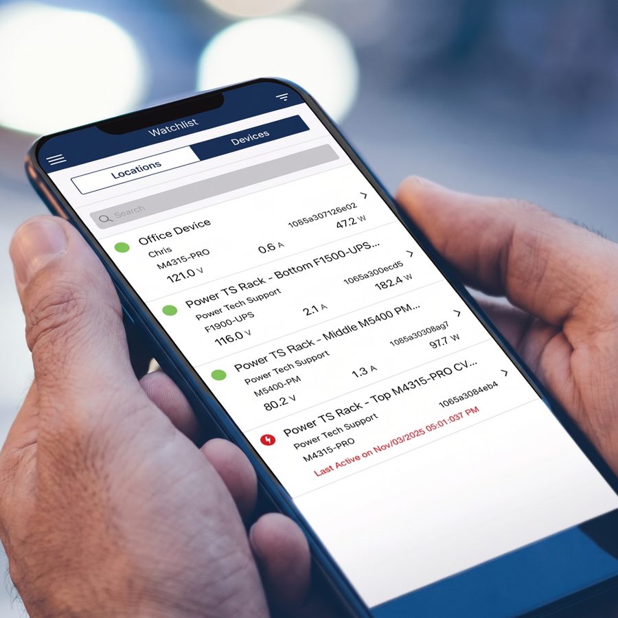 A hand holding a phone showing the BlueBOLT power control dashboard