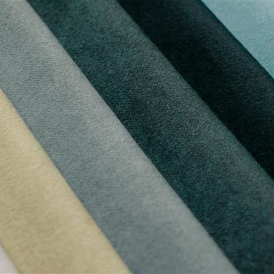 Color roller shades in a custom hue across a window