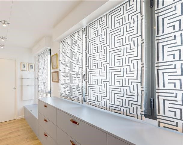 Roller shades in several custom colors and patterns